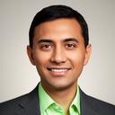 Retail merchandising executive in a studio portrait with a neutral background